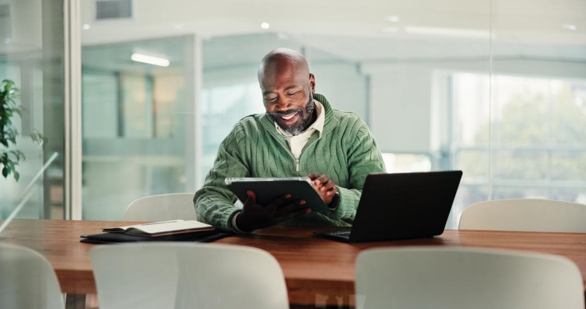 Licensed insurance agent reviewing rates on tablet
